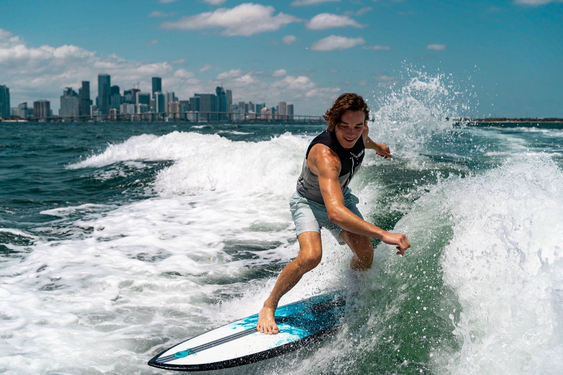 WakeXscape guest wakesurfing with the Miami skyline