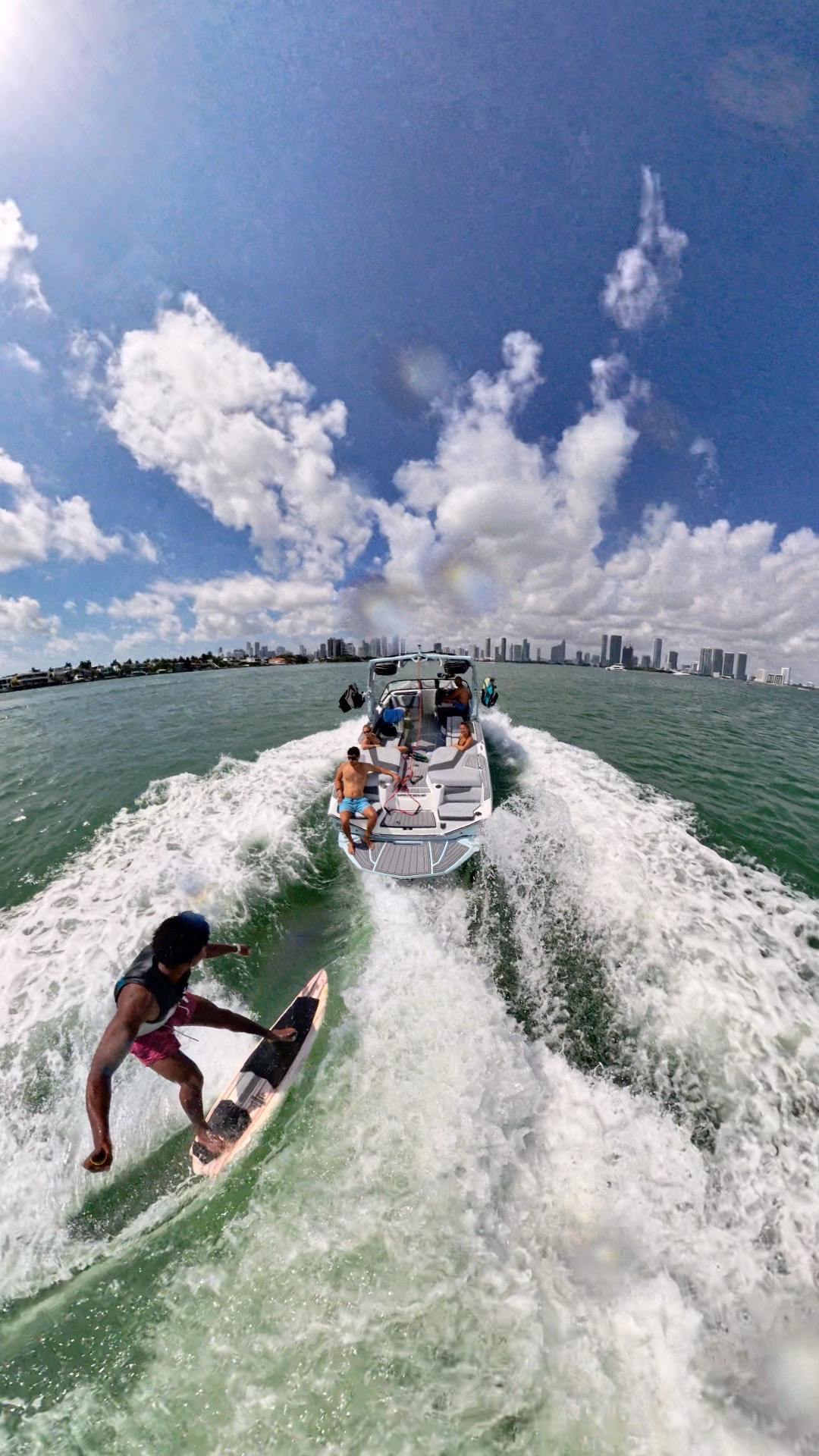 Wide wakesurf session photographed from the boat